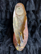 A handmade paper shoe with Swarovski crystals.
